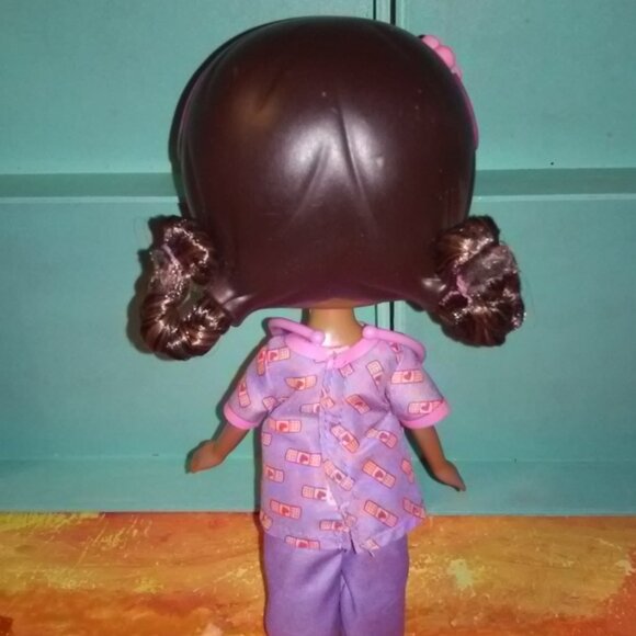 Doc Mcstuffins Doll in purple & pink  scrubs with a mini doc - Picture 7 of 8